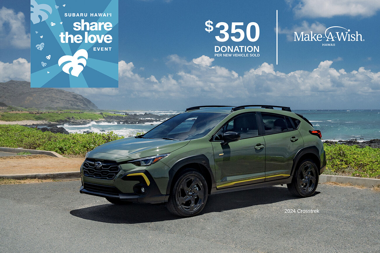 Subaru Crosstrek in the parking lot with a beach in the background.