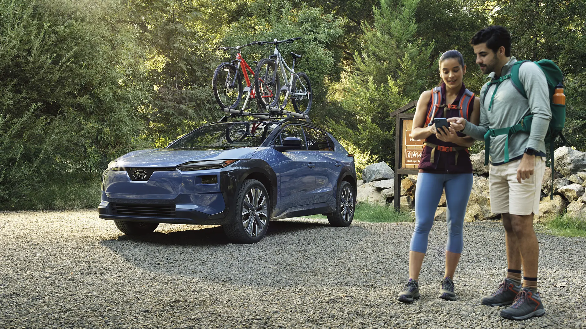 Solterra parked by trailhead with hikers