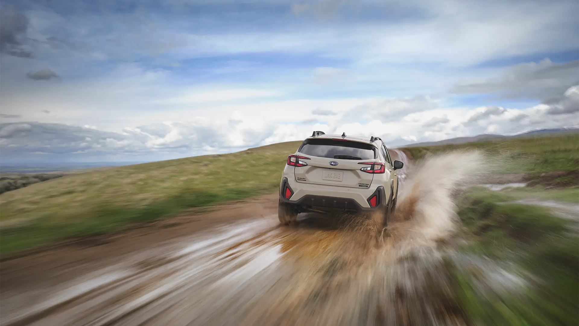 Crosstrek Hybrid driving off-road.