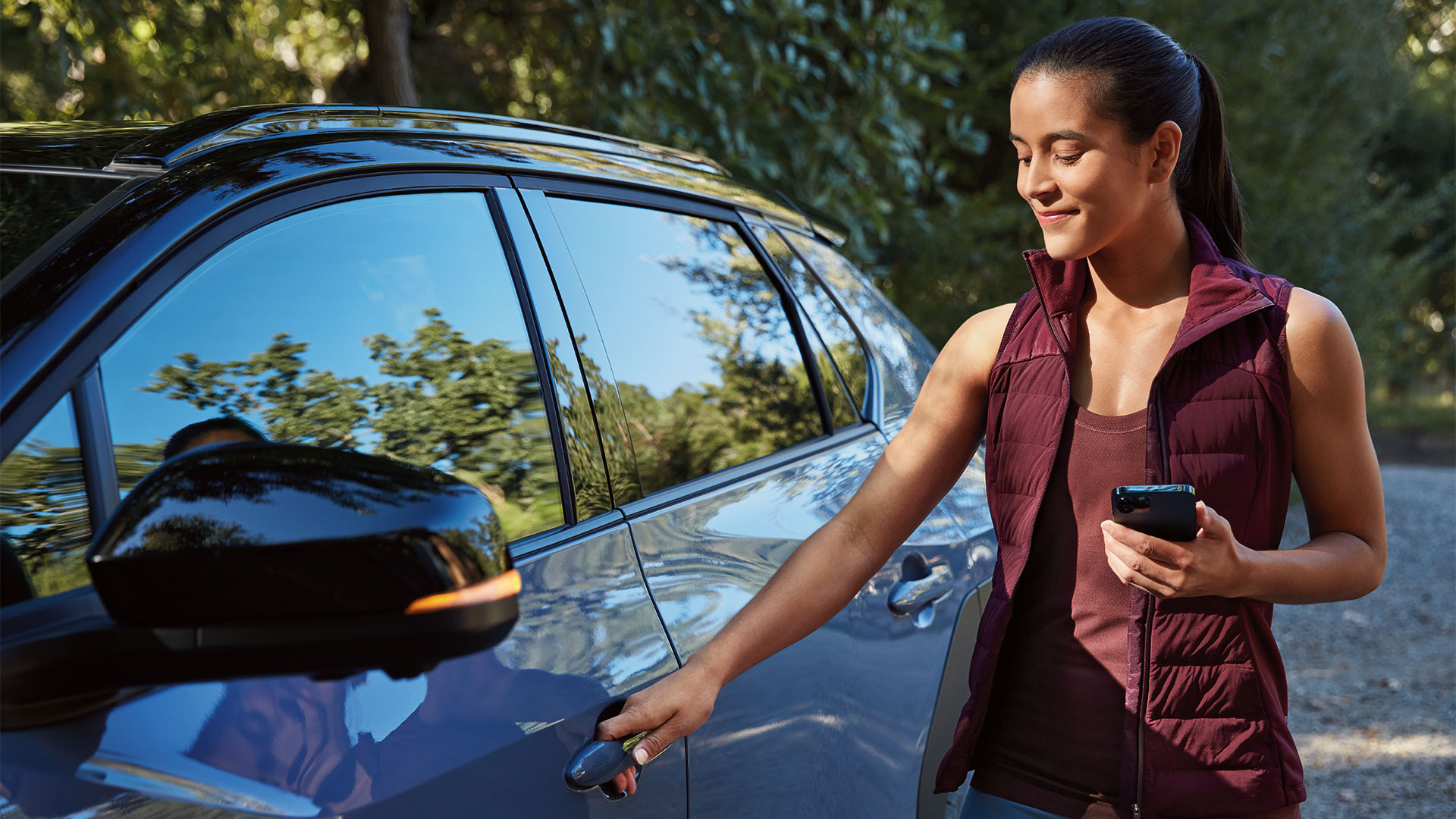 Woman unlocking Solterra with her phone